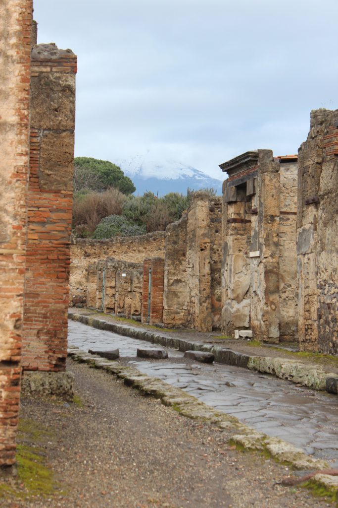 exploring the ruins of pompeii under the rain