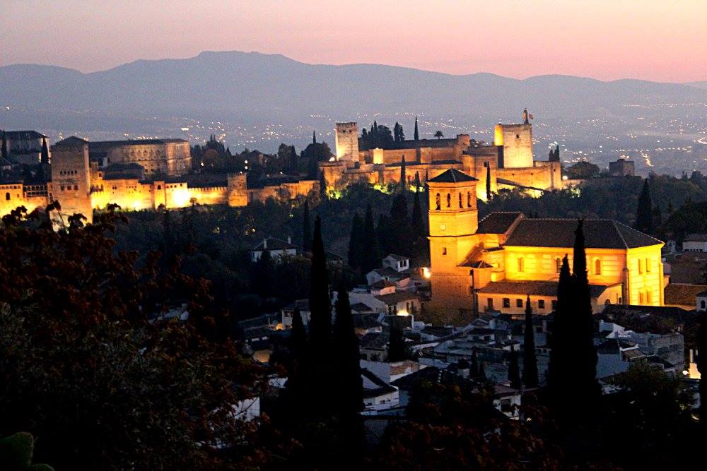 sunset in Granada from the hill of sacramonte, with the Alhambra in the background