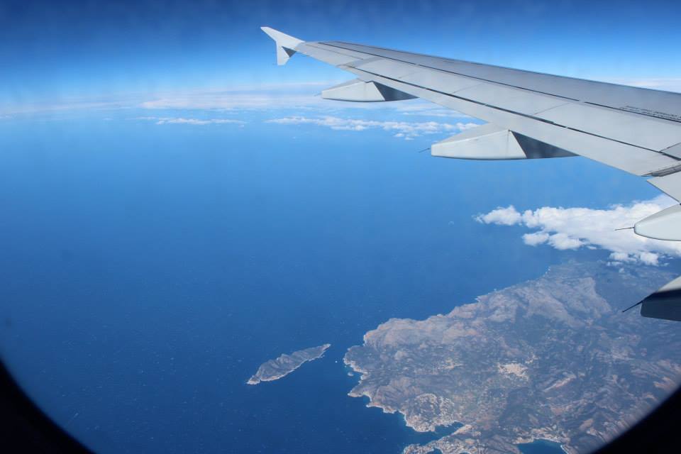 window seat view on the plane with the ocean and spanish island