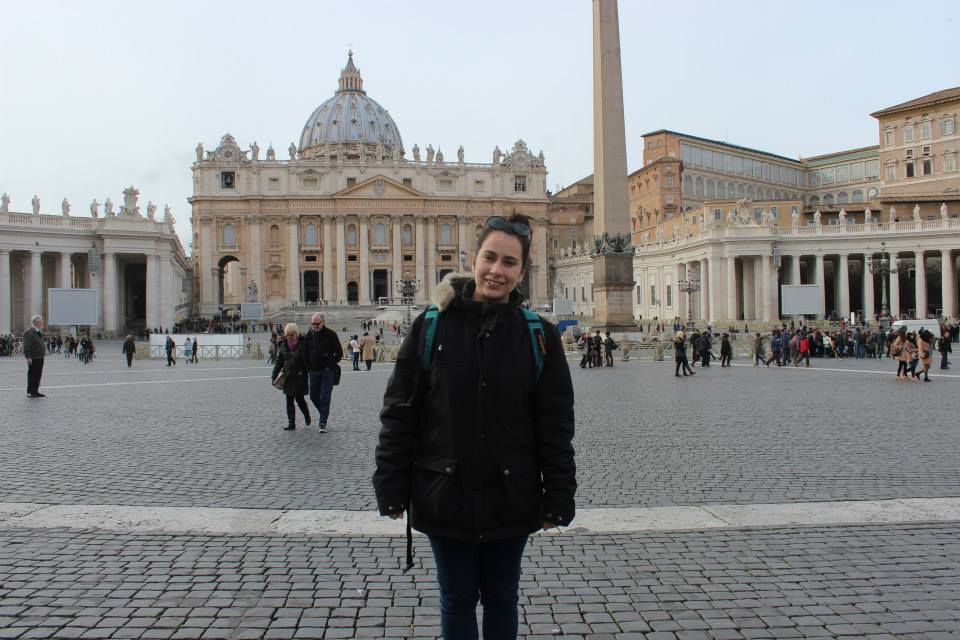standing at Saint Peter's square in the Vatican with St. Peters Church behind me