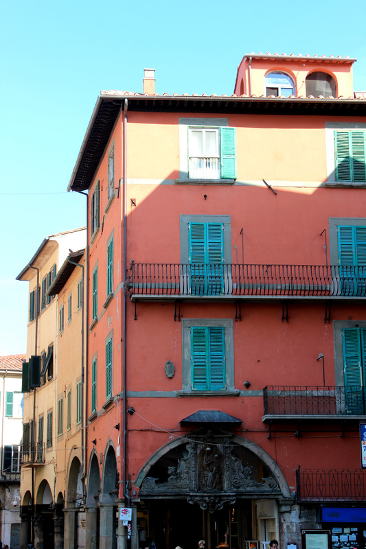 pink and pastel building in pisa