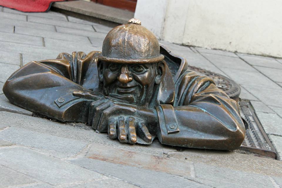 famous man on the ground statue in Bratislava
