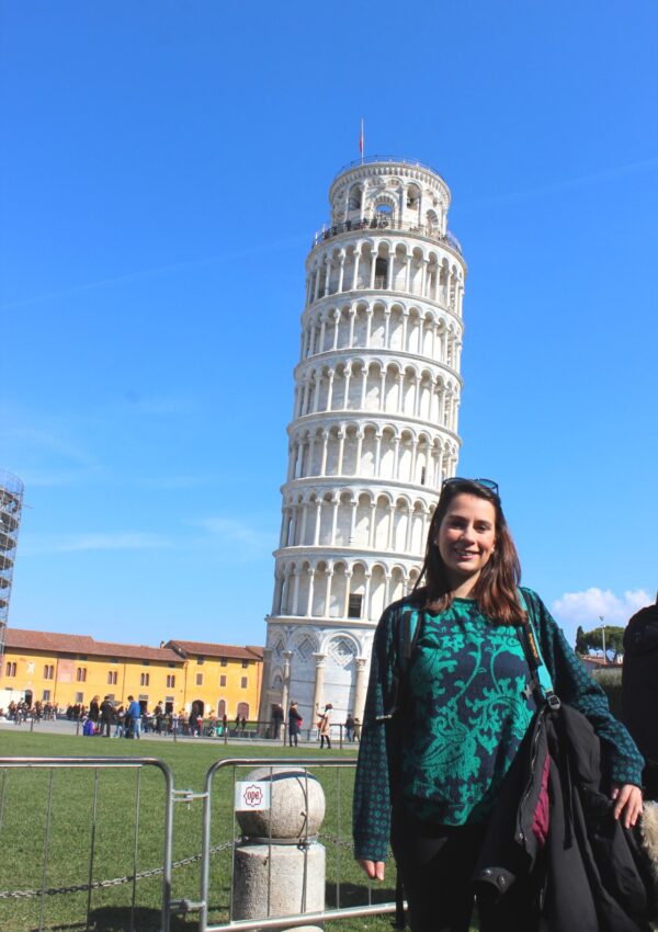 girl with the leaning tower behind her